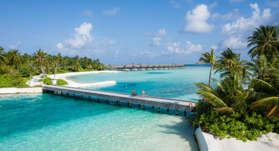 Couple cycling on the island - Niyama Private Islands Maldives