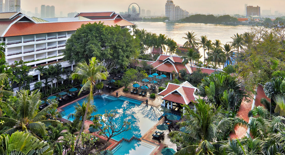Anantara Riverside Bangkok Hotel offers a peaceful riverside escape with views of passing longtail boats and vibrant local life